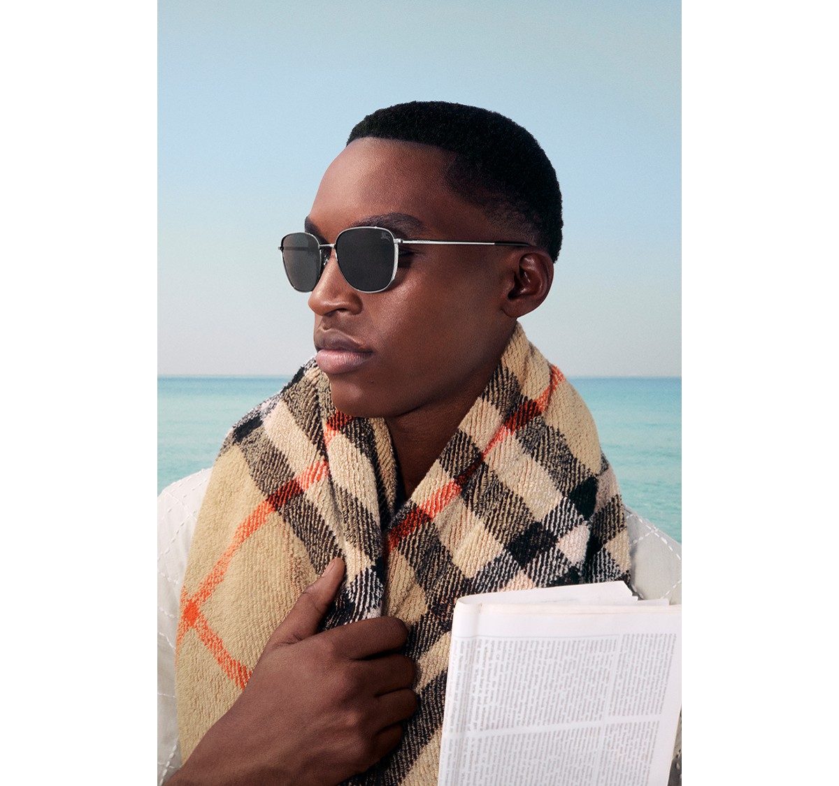 Official Burberry eyewear campaign, male model wearing sunglasses and Burberry check