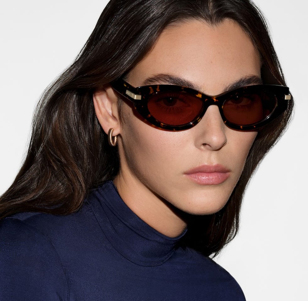Calvin Klein Eyewear studio portrait in a navy high-neck top