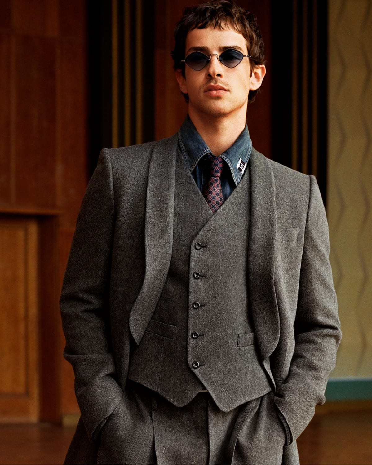 Official Emporio Armani eyewear campaign, tailored grey suit and round sunglasses